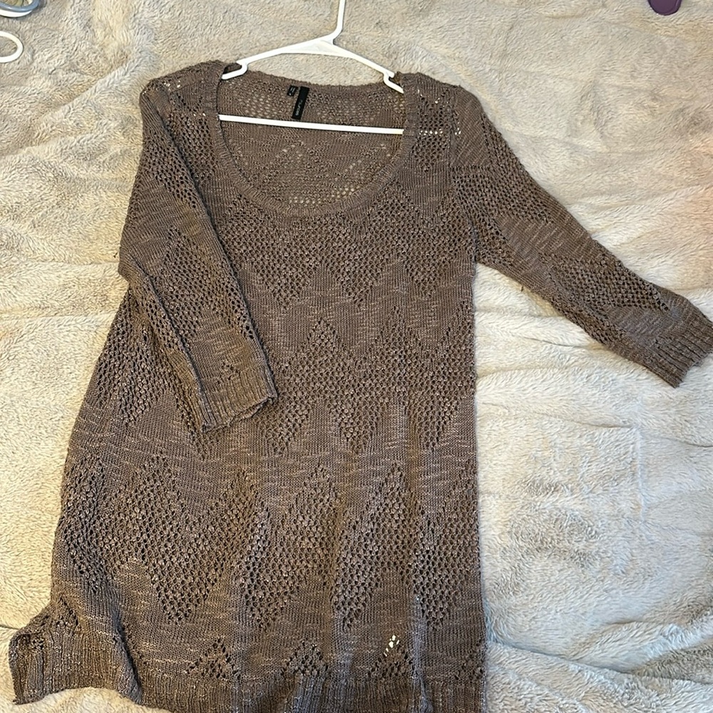 Maurice’s long knitted sweater